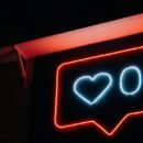 Neon Sign Displaying Heart With 0 to Indicate Zero Likes