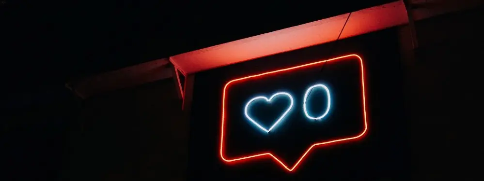 Neon Sign Displaying Heart With 0 to Indicate Zero Likes