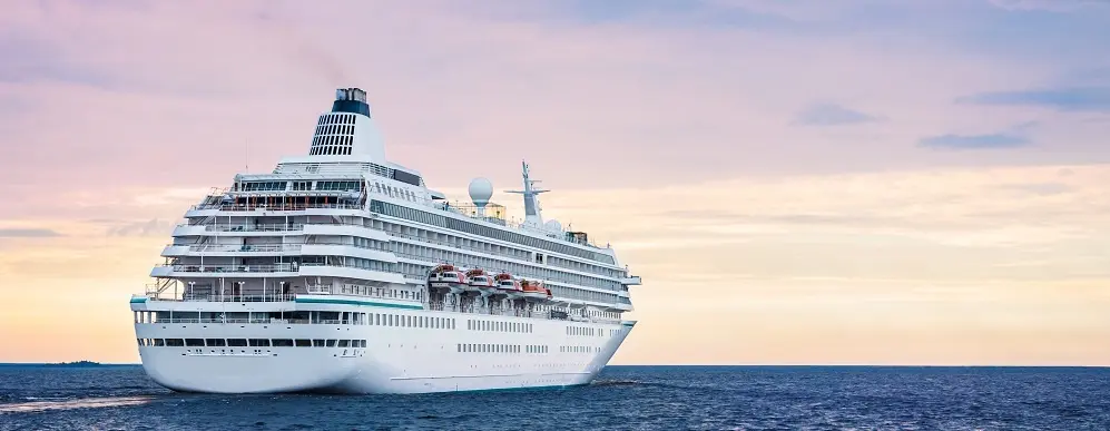 Big Cruise Ship In The Sea At Sunset