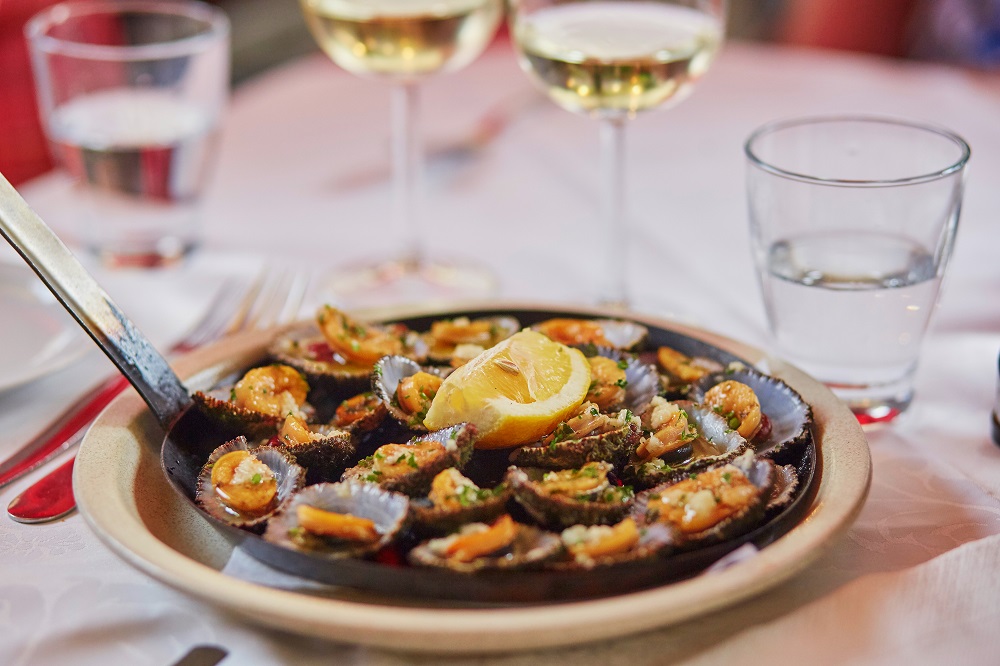 Grilled Limpets Served With Lemon Traditional Seafood On Madeira Island, Portugal
