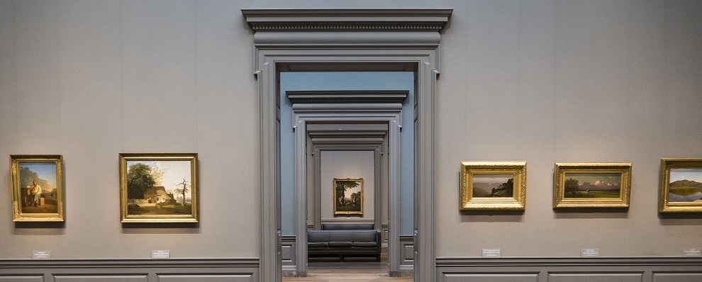 Symmetric View Of A Museum Room Looking Through Multiple Doors