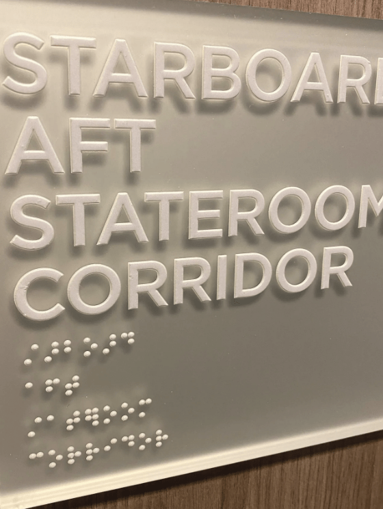Cruise ship sign with letters and braille