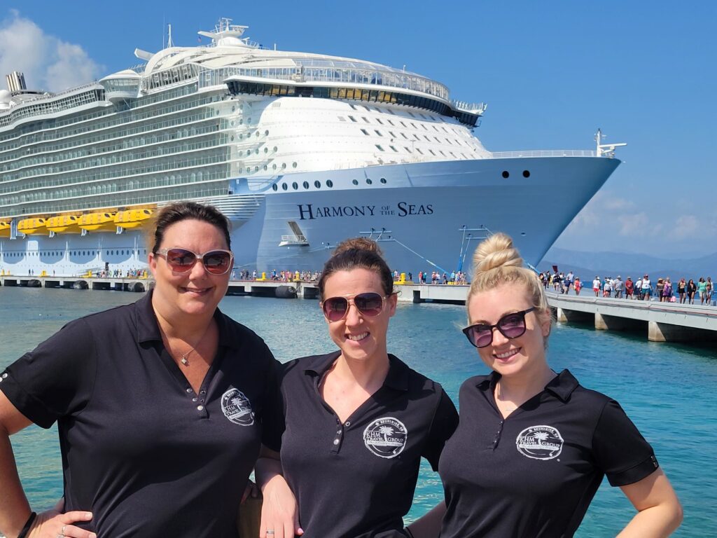 Events Team posing in front of Harmony of the Seas ship in port