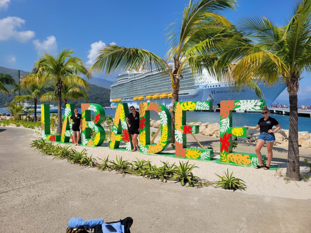 Events team posing in front of Labadee sign
