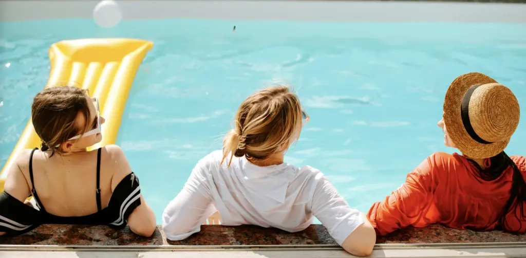 Girls Lounging In Pool