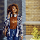Woman With Headphones Walking On Street